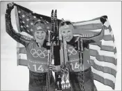  ?? Kirsty Wiggleswor­th / AP ?? United States’ Jessica Diggins (left) and Kikkan Randall celebrate after winning the gold medal in the women’s team sprint freestyle cross-country skiing final.