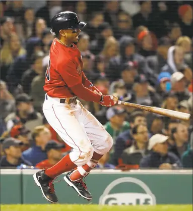  ?? Winslow Townson / Associated Press ?? Mookie Betts watches his RBI double against Baltimore during the fifth inning on Friday at Fenway Park.