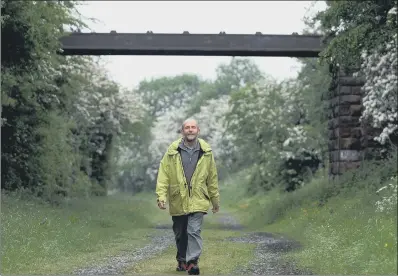  ?? PICTURE: GERARD BINKS. ?? LONG CAMPAIGN: Andy Shackleton, of the Skipton East Lancashire Rail Action Partnershi­p group, walks part of the old railway line.