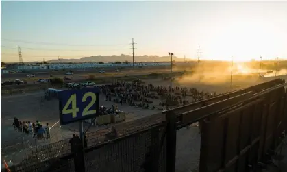  ?? Photograph: Julio Cesar Chavez/Reuters ?? Migrants at the border in El Paso last week.