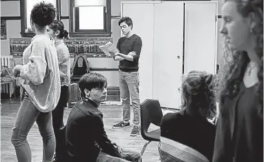  ??  ?? Sixteen-year-old Jacob Flores, center, rehearses “Columbinus,” a play based on the 1999 Columbine school shooting, at the Chicago Academy for the Arts on March 13.