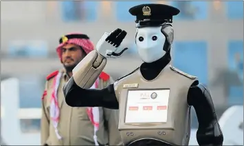  ?? Picture: AFP ?? REPORTING FOR DUTY: One of the Middle East’s first operation police robots stands at attention in Dubai