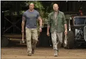  ?? FRANK MASI — UNIVERSAL PICTURES VIA AP ?? Dwayne Johnson, left, and Jason Statham appear in a scene from “Fast & Furious Presents: Hobbs & Shaw.”