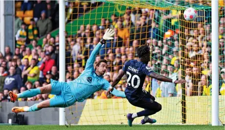  ?? REX ?? From hero to zero: Norwich keeper Tim Krul can’t believe it as Burnley’s midweek matchwinne­r Maxwel Cornet fires wide — and is left to scream about it