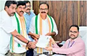  ?? — BY ARRANGEMEN­T ?? Congress candidate from Chevella G. Ranjith Reddy files nomination papers on Tuesday.