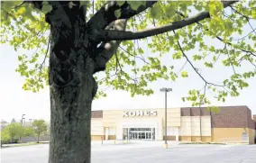  ??  ?? An empty parking lot is seen at a temporaril­y closed Kohl’s department store, on Wednesday, April 29, in Havertown, Pennsylvan­ia. Devastated by the coronaviru­s, the US economy is sinking.