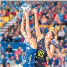  ?? Photo / Photosport ?? Anna Harrison, of the Mystics (left) and the Magic’s Lenize Potgieter battle for possession last night.