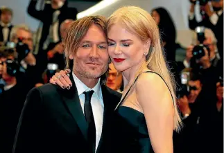  ?? REUTERS ?? New Zealand-born musician Keith Urban and his wife, Nicole Kidman.