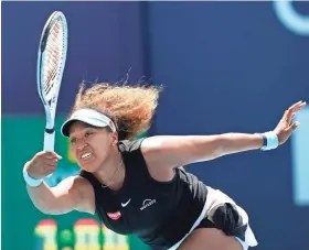  ?? LYNNE SLADKY/AP ?? Naomi Osaka hits a return to Maria Sakkari during the quarterfinals of the Miami Open on March 31 in Miami Gardens, Fla.