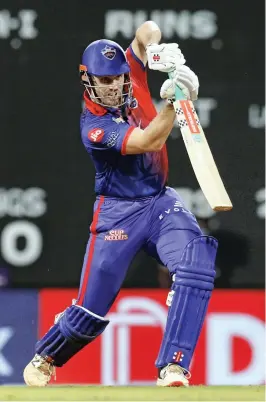  ?? IPL ?? Mitchell Marsh of Delhi Capitals plays a shot against Rajasthan Royals during their Indian Premier League match at the D. Y. Patil Stadium in Mumbai on Wednesday.—