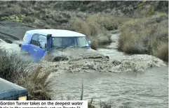  ??  ?? Gordon Turner takes on the deepest water hole in the appropriat­ely set up Toyota FJ.