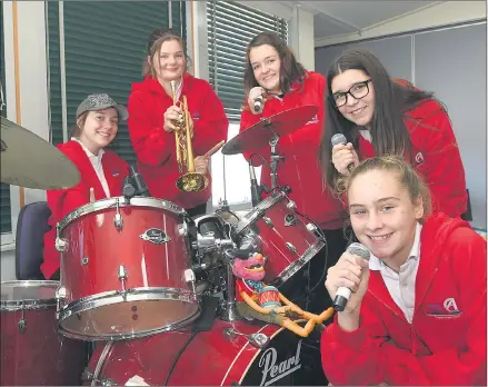  ??  ?? ROCK ON: From left, Jodie Treacy, Amelia Shill, Aria Davies-harrison, Zafirah Davies-harrison and Caitlin O’brien are members Ararat College’s school band ‘Don’t Run With Scissors’. They and other members of the band are preparing to compete in this...