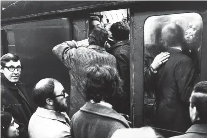  ??  ?? Let us in: The big crush as passengers try to squeeze into a rare train during another strike