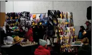  ?? ?? Attendees inspect quilts before the auction.