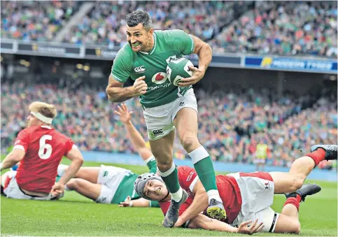  ??  ?? Hit men: Rob Kearney scores (above) for Ireland, while Johnny Sexton (below) was in the wars