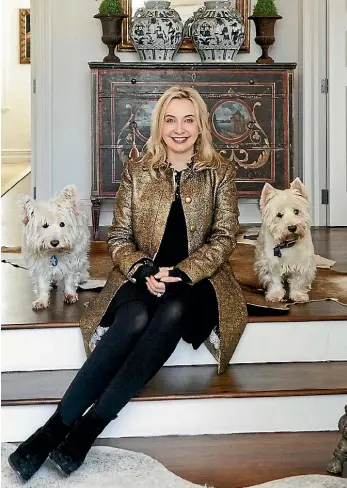  ?? SUPPLIED ?? Mary Gordon, founder of candle business Abbey Rose, at home with her dogs, Dougal and Rebus.