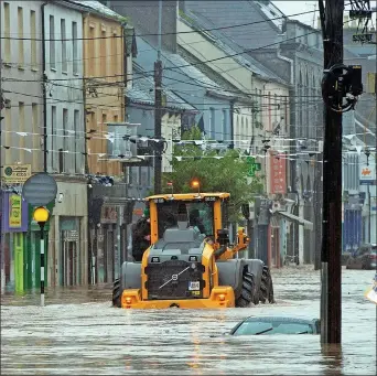  ?? ?? WATERWORLD: Flooding on Main Street in Midelton, Co Cork, after the river burst