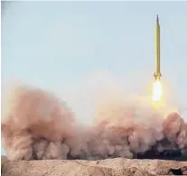  ?? IRANIAN REVOLUTION­ARY GUARD/SEPAHNEWS ?? A missile is launched in a drill Saturday in Iran. The Iranian Guard launched ballistic missiles at a simulated target in the Indian Ocean.