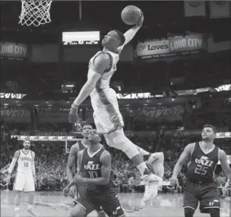  ?? SUE OGROCKI, THE ASSOCIATED PRESS ?? Oklahoma City Thunder guard Russell Westbrook goes up for a dunk against the Utah Jazz last weekend.