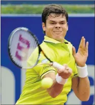  ?? MANUEL QUEIMADELO­S ALONSO GETTY IMAGES ?? Milos Raonic of Thornhill, Ont., used his strong forehand to beat Andy Murray of Britain in Barcelona on Friday.