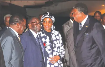  ??  ?? President Mugabe and First Lady Dr Grace Mugabe share a lighter moment with Vice Presidents Emmerson Mnangagwa and Phelekezel­a Mphoko on arrival at Harare Internatio­nal Airport last night. — (See story on Page 2). — (Picture by John Manzongo)