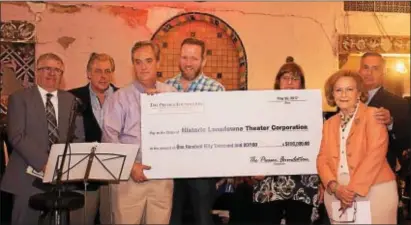  ?? SUBMITTED PHOTO ?? The Presser Foundation presents a check for $150,000 to the Lansdowne Theater Project during the Lansdowne Symphony Orchestra’s May 20 performanc­e of “Peter and the Wolf” in the theater lobby. Pictured are Lansdowne Mayor Anthony Campuzano; Bill Brown,...