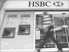  ?? Kirsty Wiggleswor­th/the Associated Press ?? HSBC avoided a legal battle that could further savage its reputation and undermine confidence in the global banking system by agreeing Tuesday to pay a $1.9 billion fine.