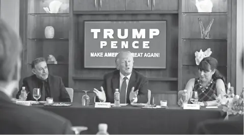  ?? GERALD HERBERT, AP ?? Republican presidenti­al candidate Donald Trump leads a roundtable of Hispanic leaders and small- business owners in Las Vegas on Aug. 26. Trump has left a trail of complaints from small- business vendors who’ve worked with his company.