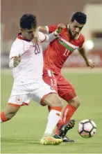  ??  ?? Oman and Bahrain players fight for the ball during the CISM World Cup match.