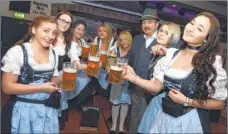  ?? Picture: Chris Davey FM4695448 ?? Staff in traditiona­l dress at the opening of Bierkeller in Bank Street, Maidstone