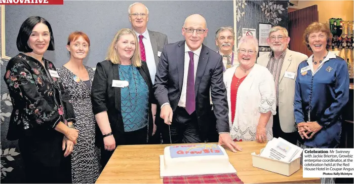  ??  ?? Celebratio­n Mr Swinney with Jackie Brierton, Growbiz enterprise coordinato­r, at the celebratio­n held at the Red House Hotel in Coupar Angus