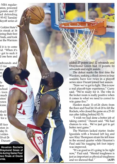  ??  ?? James Harden of the Houston Rockets dunks the ball against Draymond Green of the Golden State Warriors during Game Four of the Western Conference Finals at Oracle Arena in Oakland, California. AFP