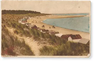  ??  ?? Top: Pride of Britain’s seaside: cheerful beach huts at Wells-next-the-sea, Norfolk. Above: A postcard sent from Wells in about 1920. The message on the reverse, to a Master John Reeve, reads: ‘This is the beach where nanny takes her tea now, don’t you think it looks pretty? Hope you are still being a good boy. Lots of love, Nanny xx’