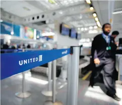  ?? JOSHUA LOTT / AFP / GETTY IMAGES FILES ?? Ticketed passengers bumped from U. S. airlines have dropped to 44 per million passengers from April to June.