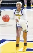  ?? STAFF FILE PHOTO BY C.B. SCHMELTER ?? UTC forward Eboni Williams takes the ball down court against East Tennessee State University at McKenzie Arena.