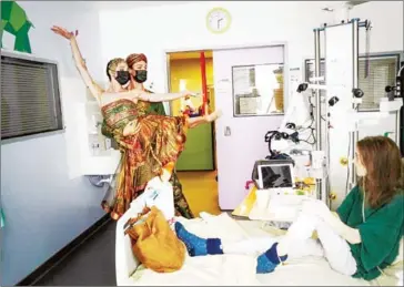  ?? AFP ?? French Etoiles (star dancers) of the Paris Opera Ballet Hugo Marchand and Dorothee Gilbert dance for Maely in the intensive care child unit of the Hopital Necker-Enfants Malades AP-HP in Paris.