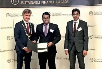  ??  ?? DFCC Bank Senior Vice President Branch Banking Bathiya Alahakoon accepts the award on behalf of DFCC Bank. The presentati­ons were made at Karlsruhe City Hall on July 12, 2018 by Lord Mayor of Karlsruhe Dr. Frank Mentrup and European Organisati­on for...