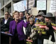  ?? MANUEL BALCE CENETA — THE ASSOCIATED PRESS ?? Sen. Elizabeth Warren, D-Mass., speaks at a rally outside the Consumer Financial Protection Bureau headquarte­rs in Washington, Tuesday. The group was protesting President Donald Trump’s appointmen­t of Mick Mulvaney as Consumer Financial Protection...