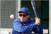  ?? ASSOCIATED PEESS ?? Chicago Cubs minor league hitting coach Rachel Folden hits infield ground balls at the Cubs spring training facility in Mesa, Ariz.