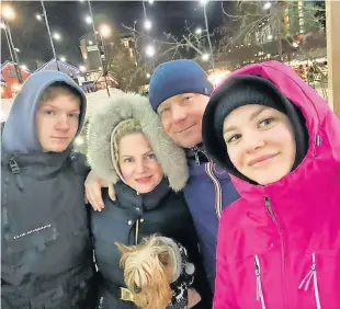  ?? ?? Togetherne­ss Luda, with son Vova, daughter Vika, husband Vova and family pet Miki, pictured in January before the outbreak of war