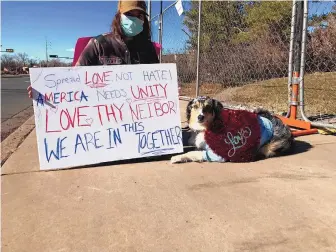  ?? T.S. LAST/JOURNAL ?? Jaquelyn Martinez and her dog Mija were the only demonstrat­ors outside the Roundhouse last weekend.