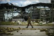  ?? FRANCISCO SECO — THE ASSOCIATED PRESS ?? A Ukrainian serviceman walks past a destroyed gypsum manufactur­ing plant Saturday in Bakhmut, eastern Ukraine.