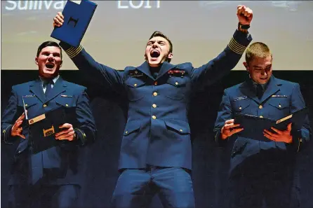  ?? SARAH GORDON/THE DAY ?? From left, first-class Cadets Logan Sullivan, Kurt Caminske and John Groen receive their first duty assignment­s Thursday during billet night at Leamy Hall at the Coast Guard Academy. Go to theday.com to see a photo gallery.