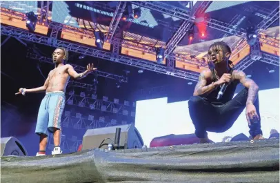  ?? PHOTOS BY MICHAEL TULLBERG, GETTY IMAGES, FOR COACHELLA ?? Slim Jxmmi and Swae Lee take the stage on Day 1 of the Coachella Valley Music and Arts Festival April 15 in Indio, Calif.