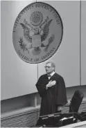  ?? JIMMY JENKINS/KJZZ ?? Magistrate Judge David Duncan sings the national anthem at a naturaliza­tion ceremony in Phoenix.