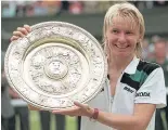  ?? AP ?? Jana Novotna with the Wimbledon trophy in 1998.