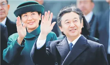  ??  ?? File photo shows Prince Naruhito (right) and and his wife Crown Princess Masako wave as they send off Emperor Akihito and Empress Michiko boarding a special flight for their visit to Vietnam and Thailand, at Haneda Airport in Tokyo, Japan. — Reuters...