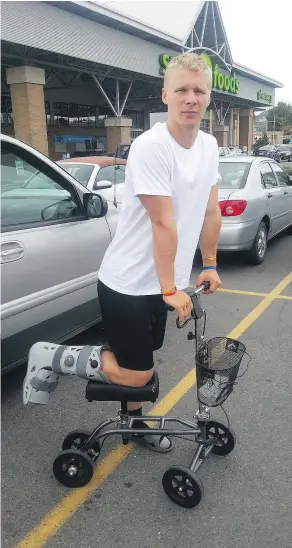  ??  ?? A broken foot earned UBC freshman football/basketball player Parker Simson the nickname ‘Wheels.’ The Kelowna Secondary grad is hoping to be healthy and ready for the start of football practices.