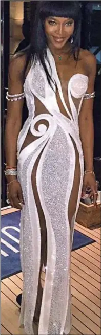  ??  ?? Hostess: Naomi Campbell in her Versace gown