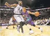  ?? KATHY WILLENS/THE ASSOCIATED PRESS ?? The 3 Headed Monsters’ Jason Williams, right, drives up against Ghost Ballers Ivan Johnson during the first half of Game 1 in the Big3 Basketball League debut Sunday in New York.